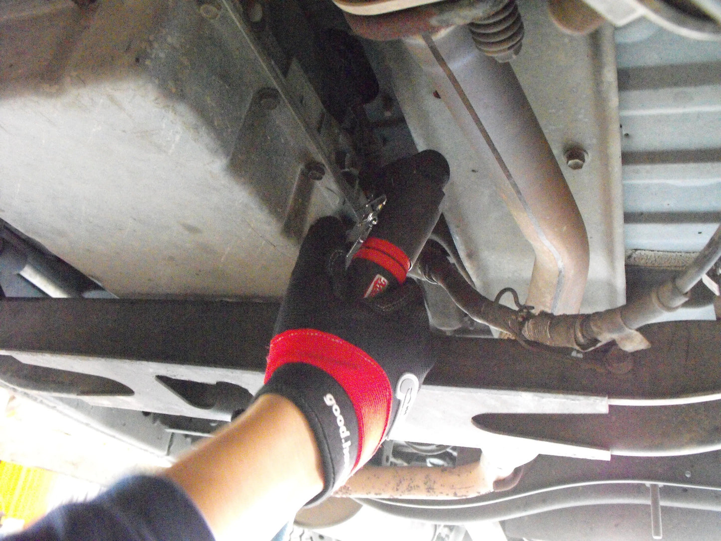 a close up of a person working on a vehicle
