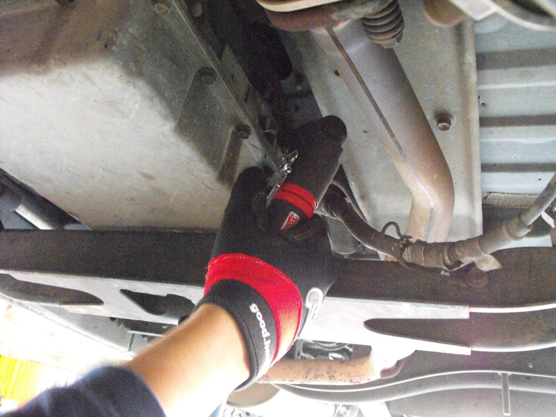 a close up of a person working on a vehicle