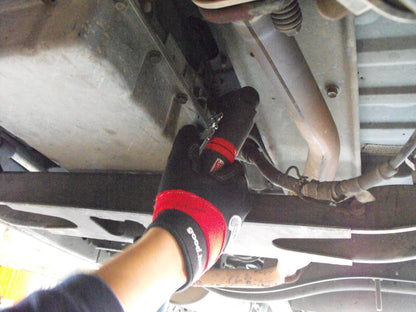 a close up of a person working on a vehicle